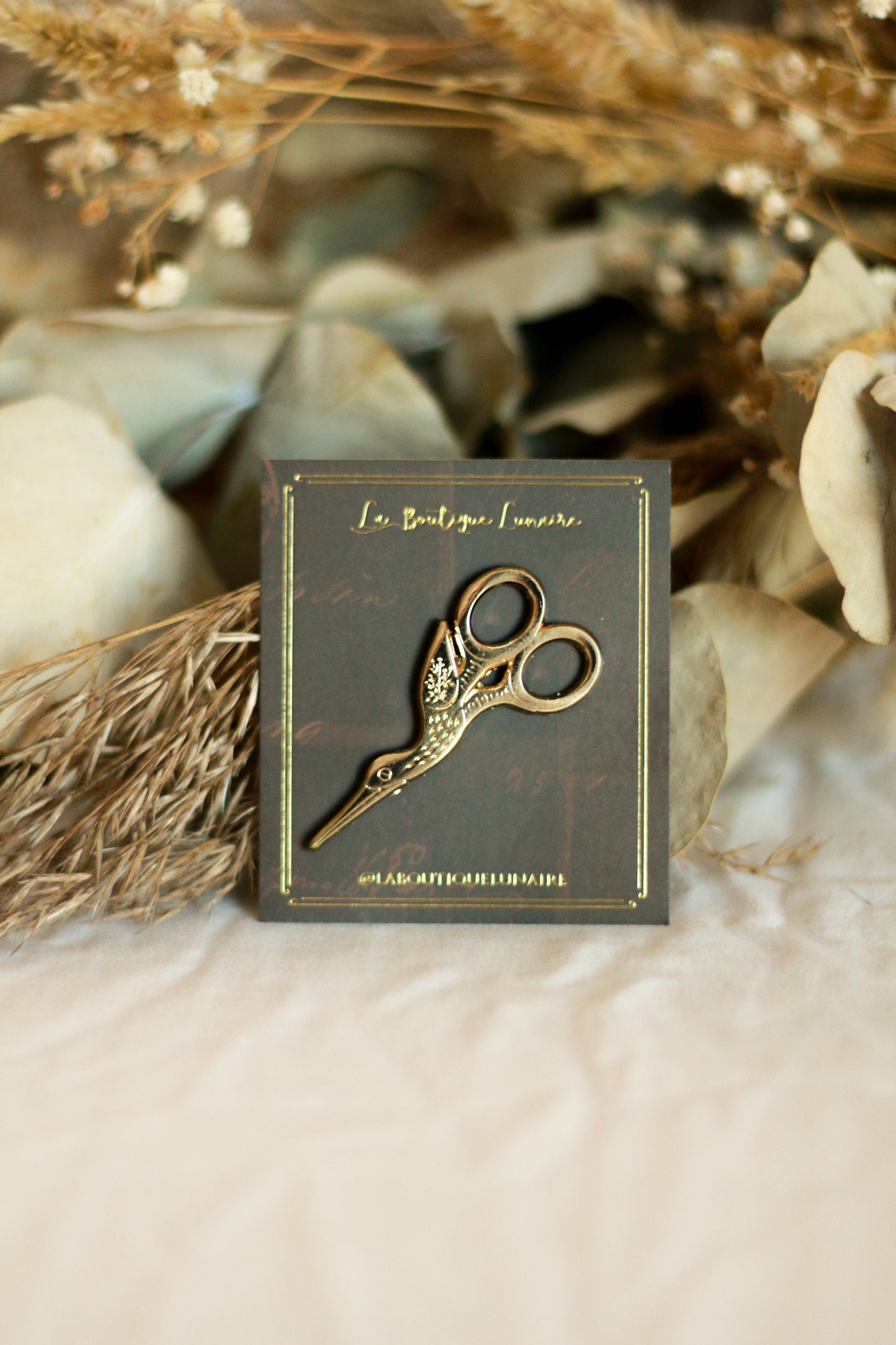 Pin's ciseaux cigogne dorés