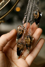 Pendule obsidienne et fougère