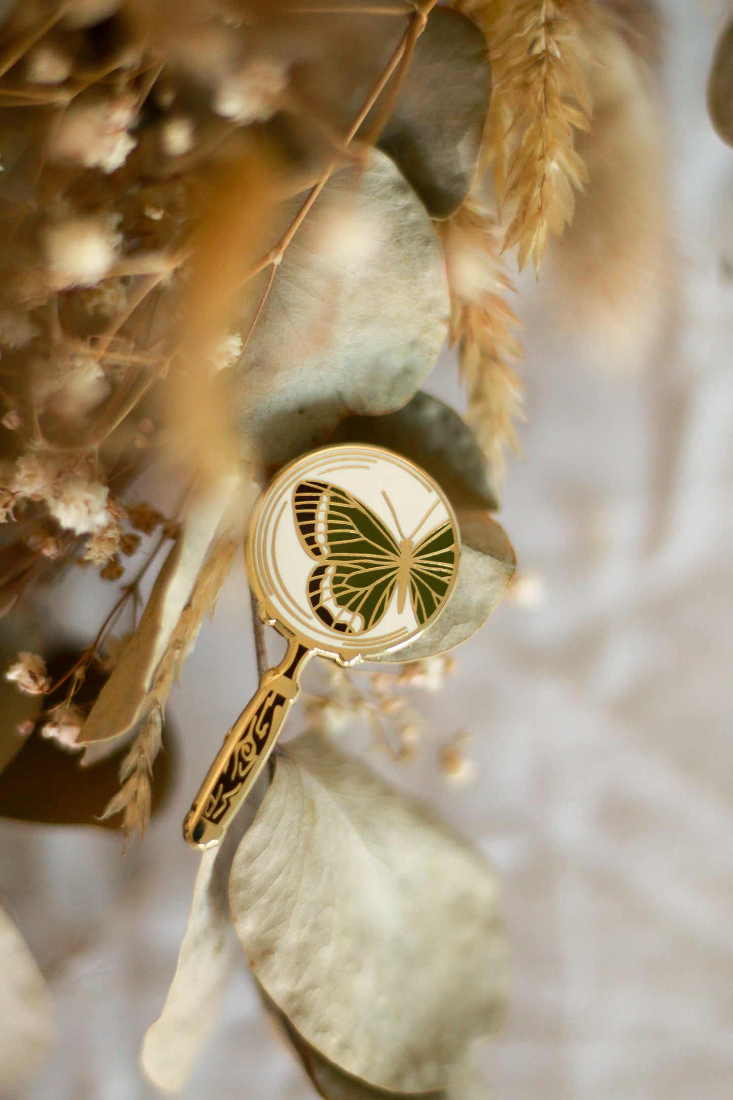 Magnifying glass pin